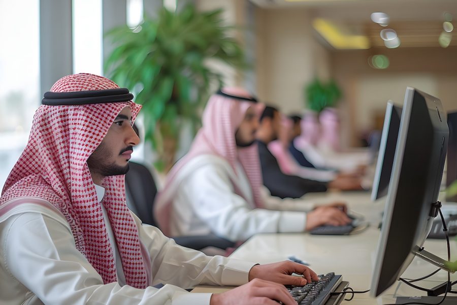 Saudi people working, spacious work space, modern office, elegant office, computers in front of them, spacious work spaces